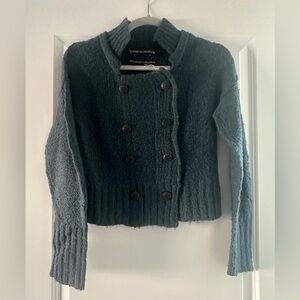 Free People woman’s cropped sweater.